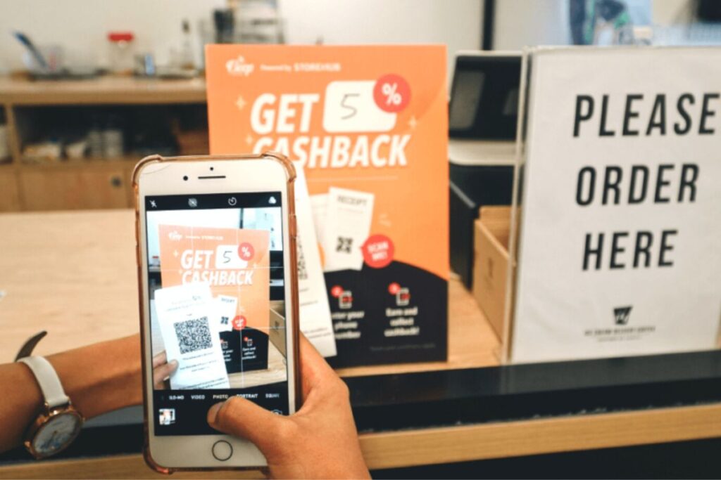 Scanning A Qr Code Through Your Phone To Enjoy Cashback 1200x800 1